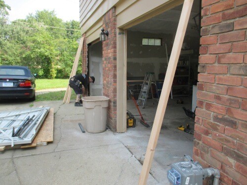 alt="five star doors installer Shane installing a door track on a new door"